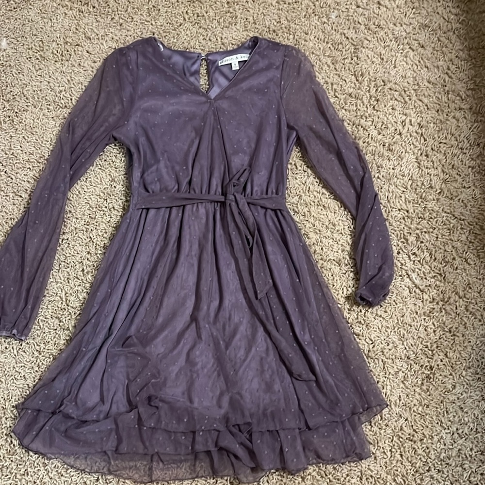 Long sleeve dress with tie at waist.